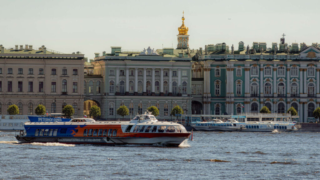 Several Meteor hydrofoil boats, including the prominent "Peterhof Express," docked at a pier in St Petersburg, Russia