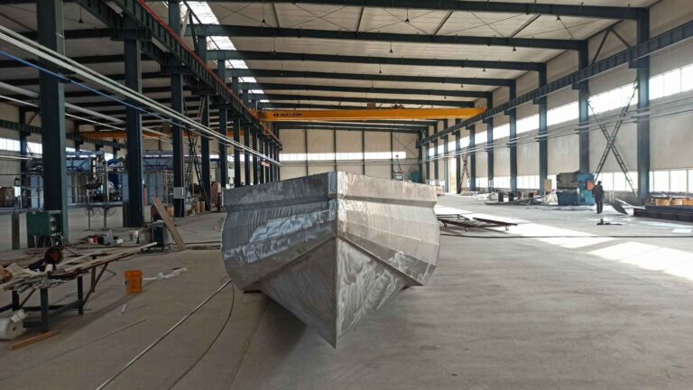 Aluminum V hull boat under construction in a boatbuilding workshop