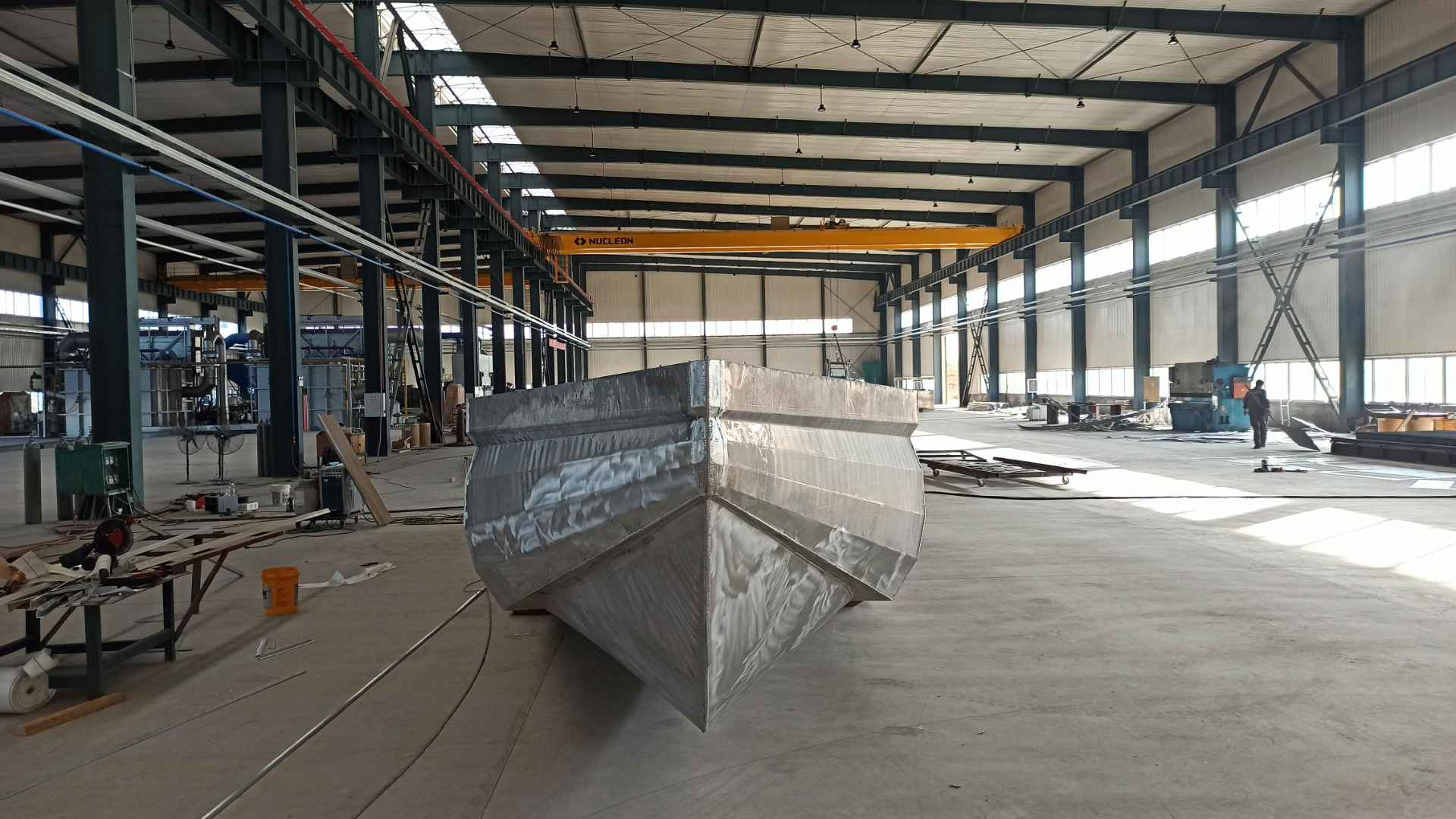 Aluminum V hull boat under construction in a boatbuilding workshop